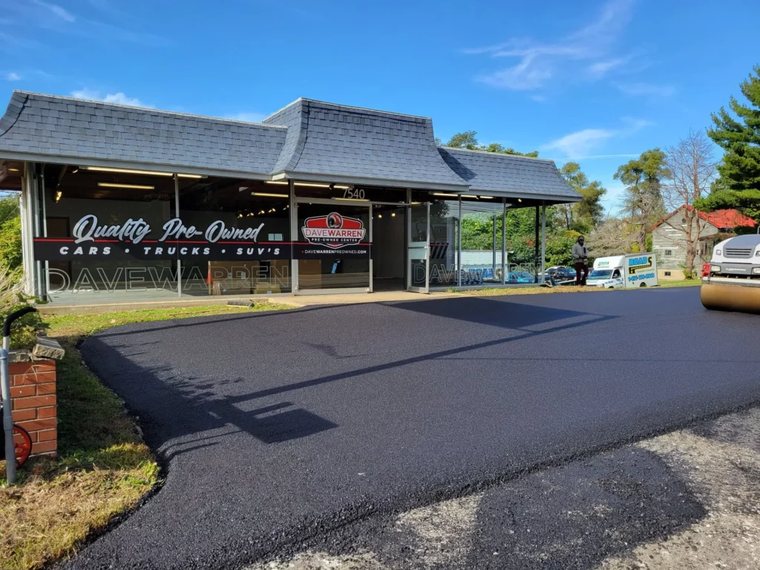 Freshly repaired asphalt driveway in Erie, PA
